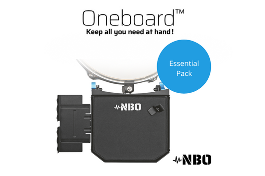 A black and gray Oneboard Essential Pack by NBO, featuring a steel main board with a clamp and various accessories including an extension, mouse pad, and velcro.